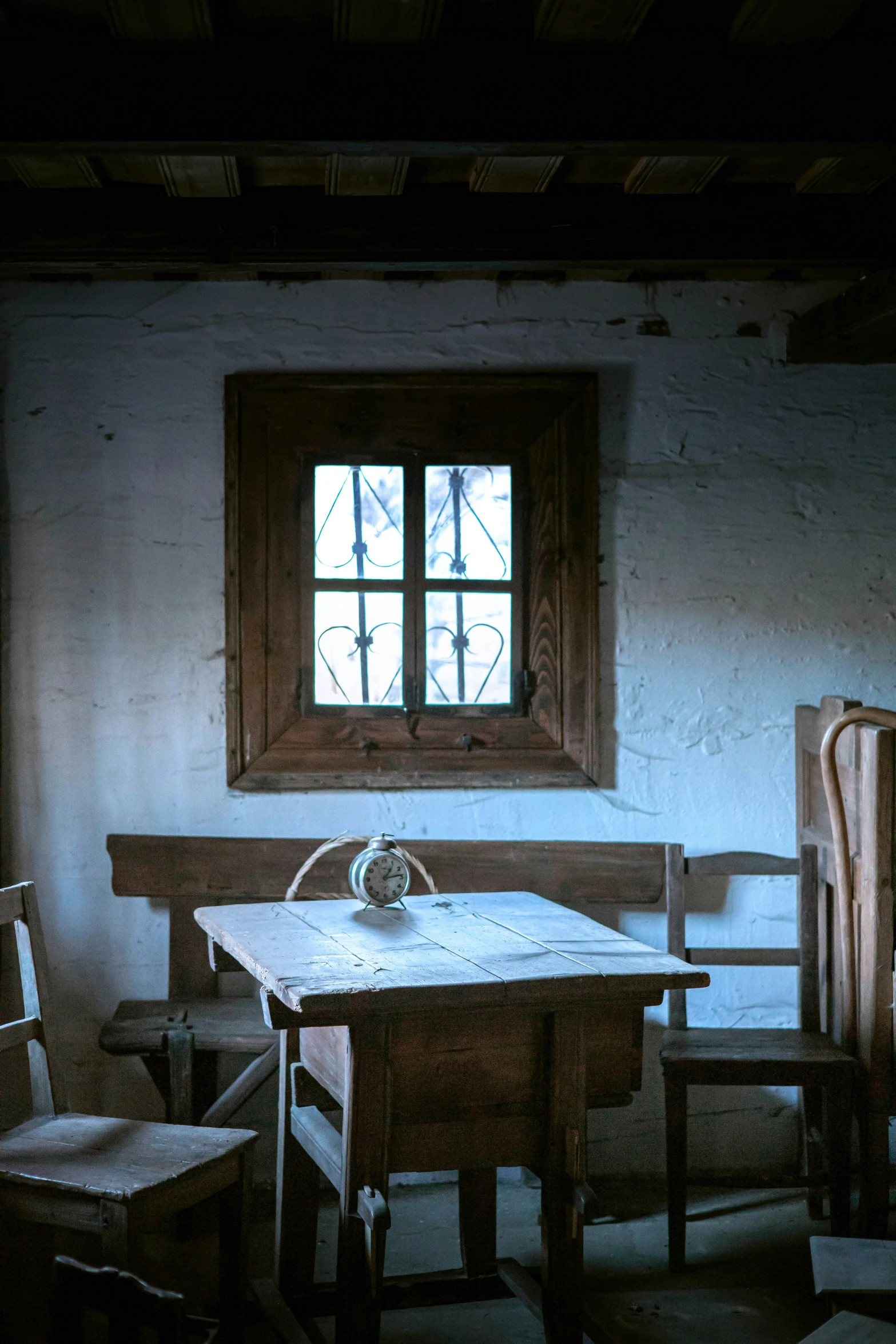 a kitchen that has a wooden dining table