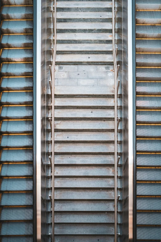 an image of a person walking up the escalator at the airport