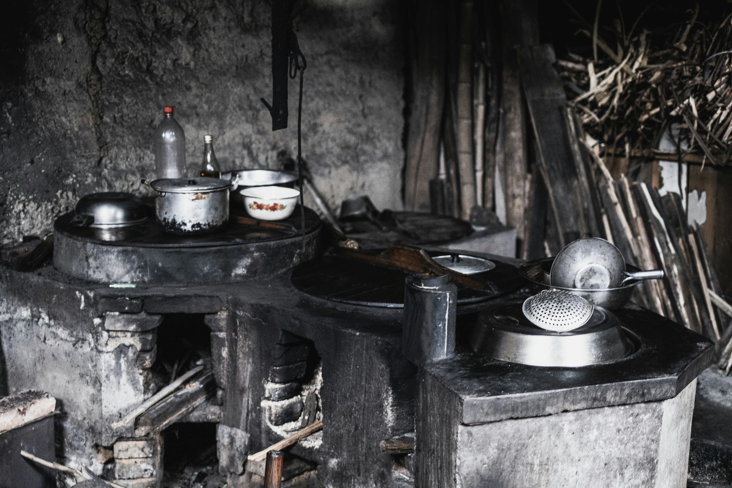 the stove is covered with pots and pans