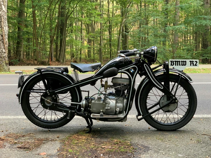 a black motorcycle parked on the side of a road