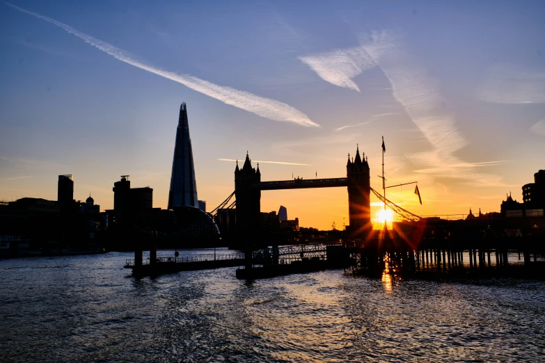 the sun is setting over the city as it sets