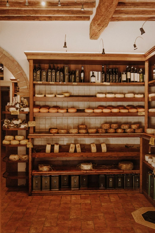 a bakery with shelves and bread displayed on the shelves