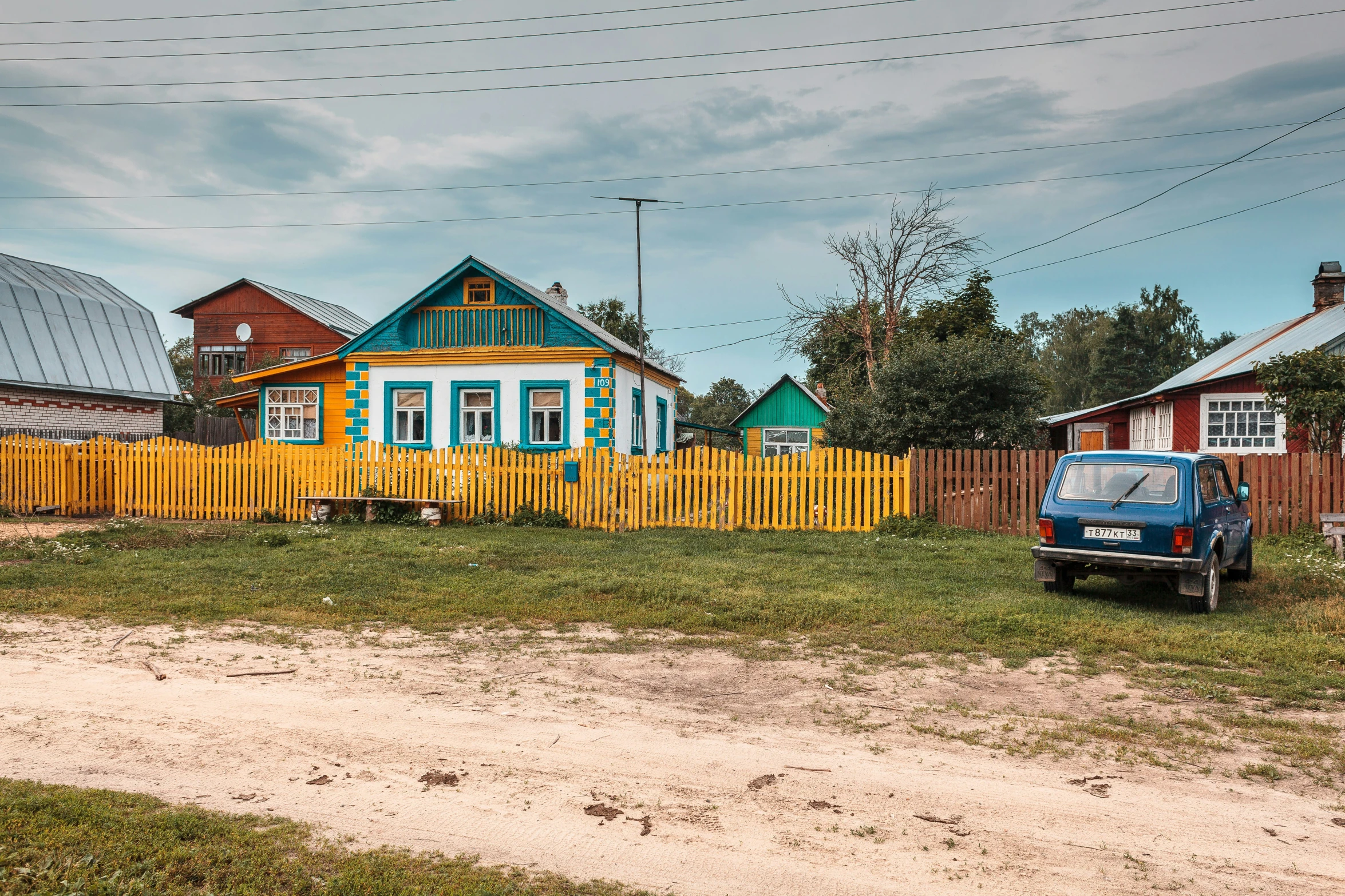 two small houses near each other in a yard