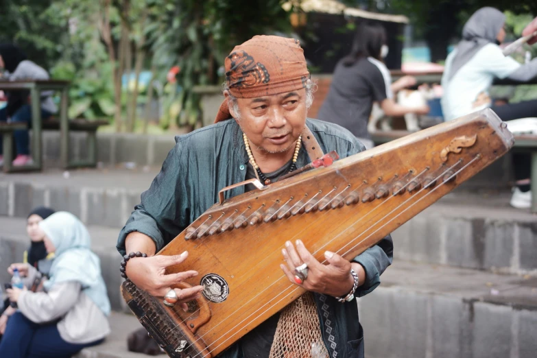 an old woman with some kind of musical instrument