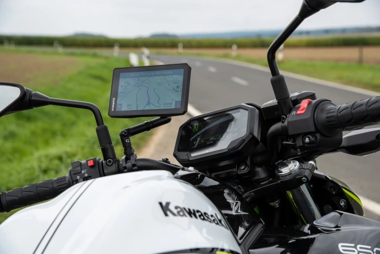 the electronic gps on the handlebars of a motorcycle