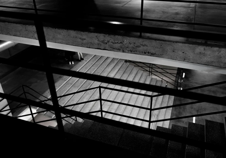 stairs and railings leading down into an open building
