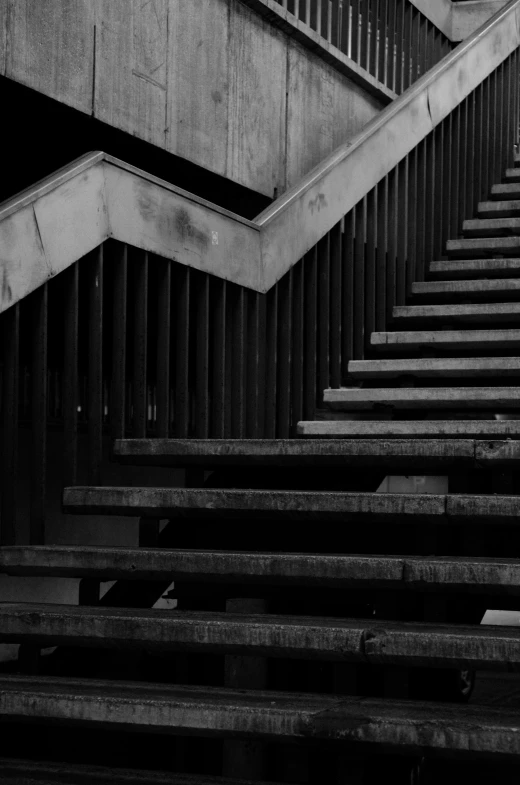 a view of a set of stairs and railings from the top