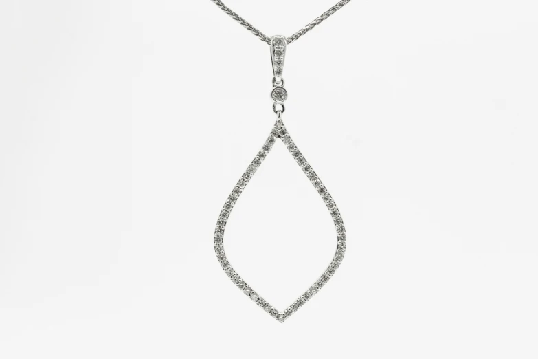 a long white necklace that has been set with diamonds