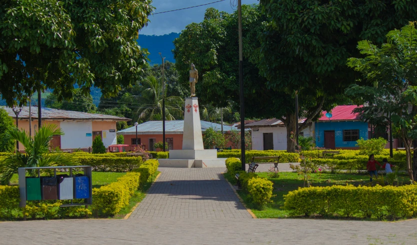 there is a statue on the top of a block of land