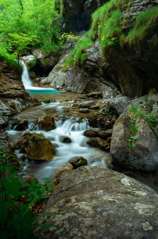 water flowing over rocks and into a river