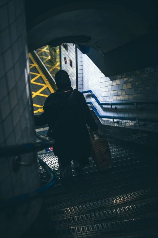 two people on a staircase with luggage and bags