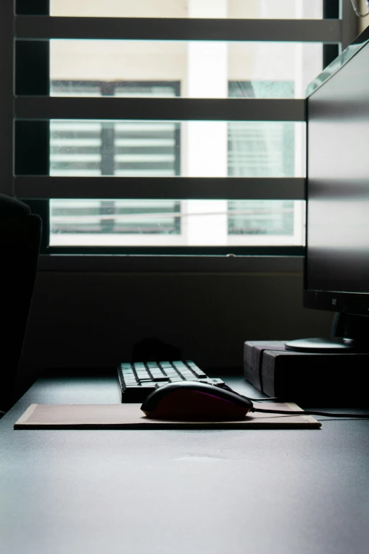 an image of the computer keyboard that is on the desk