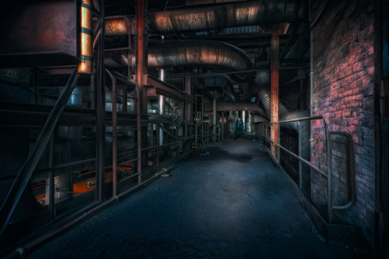 the interior of an old factory building, with pipes and pipe work