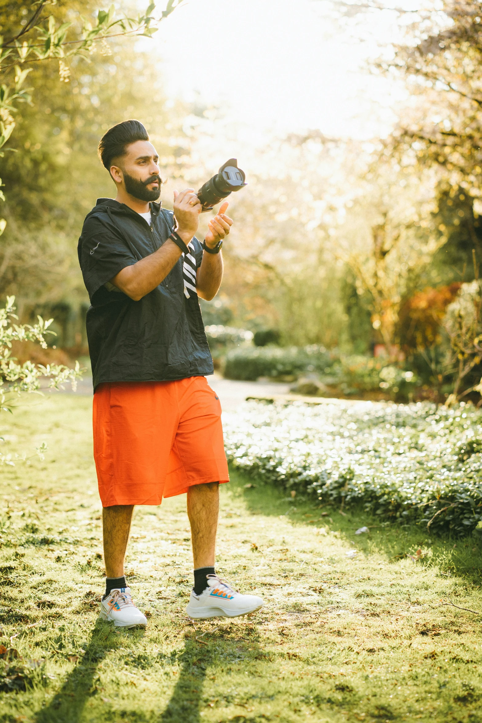 a man holds a small garden item in his hands