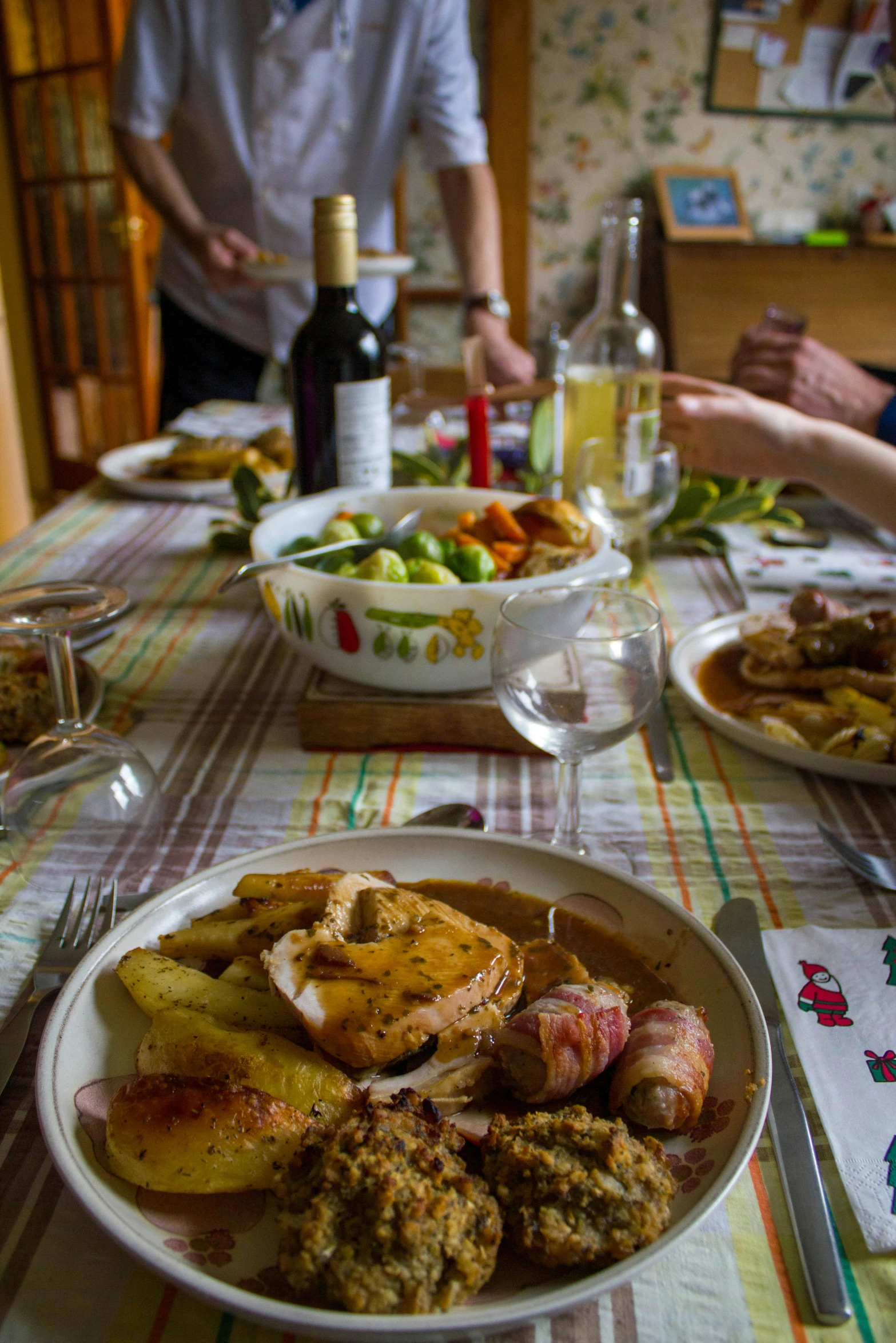 some dinner plates with meat and potatoes on a table