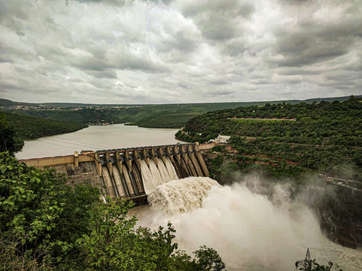 large water dam in the middle of the woods