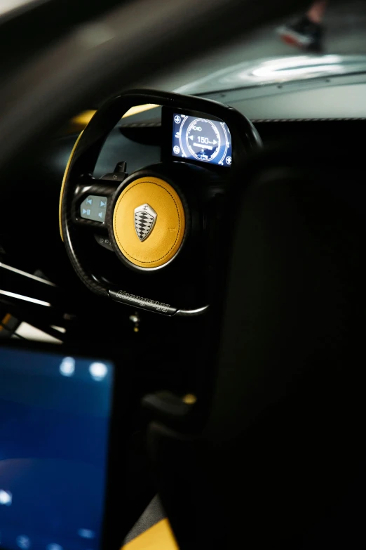 a view of a dashboard mirror with a blue tablet