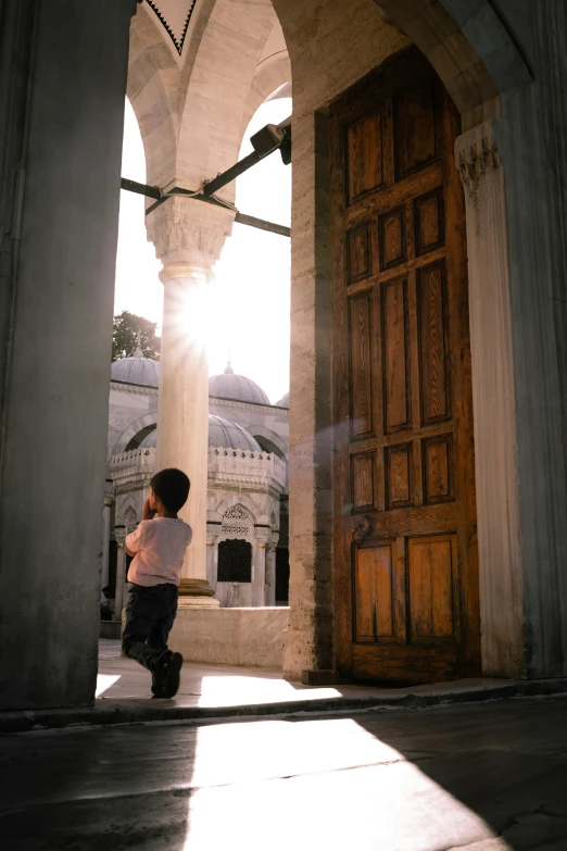 an old door opens to an empty courtyard