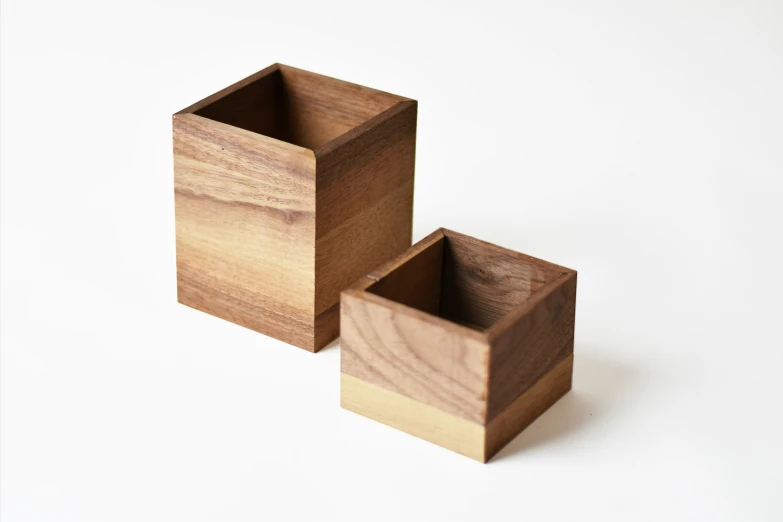 two square wood vases one is made out of wood