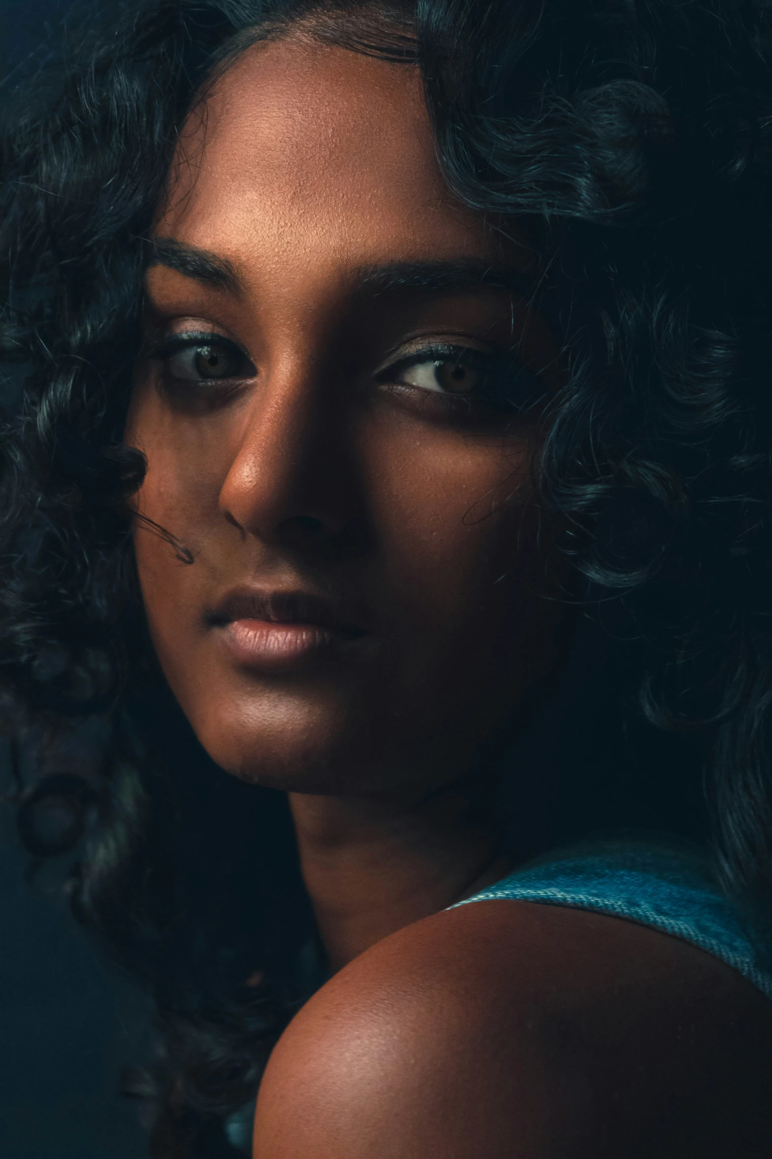 a very close up s of a woman with a serious look on her face