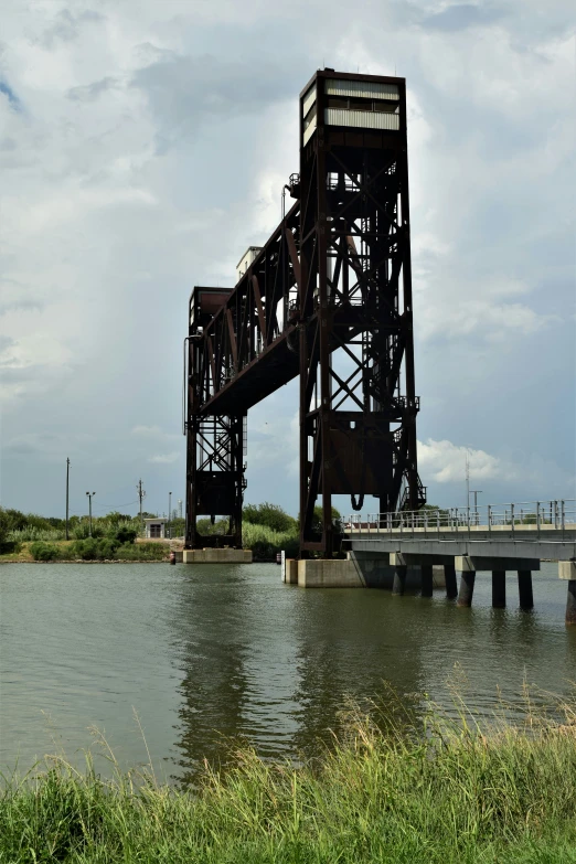 a bridge over the water with its stairs open