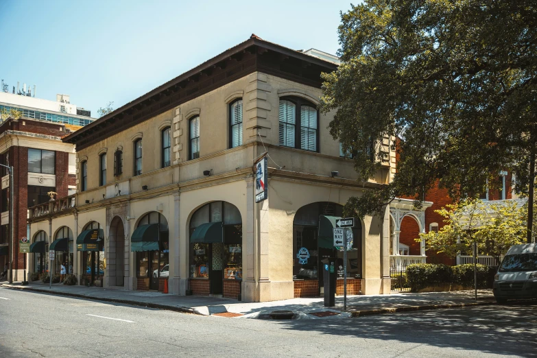 a brick building on the corner of the road