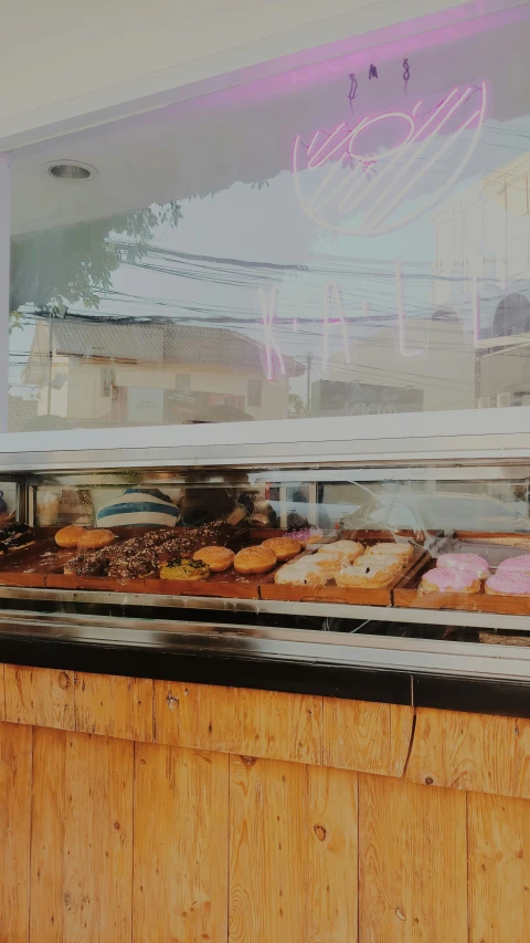 donuts on display in a deli display case