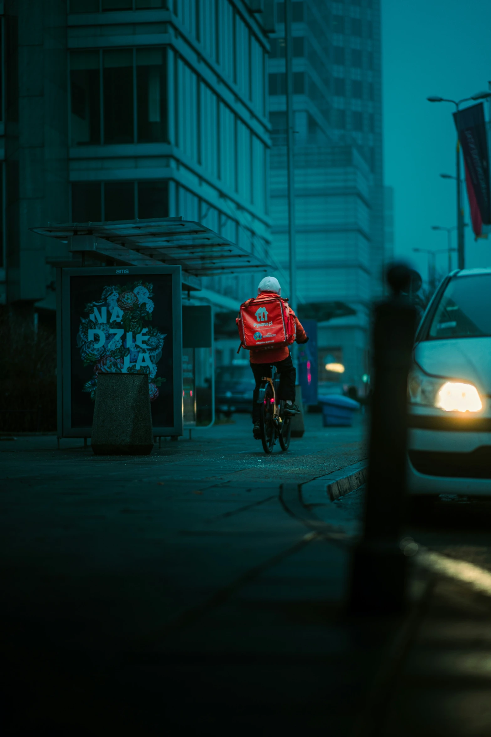 a person riding a bike in the dark