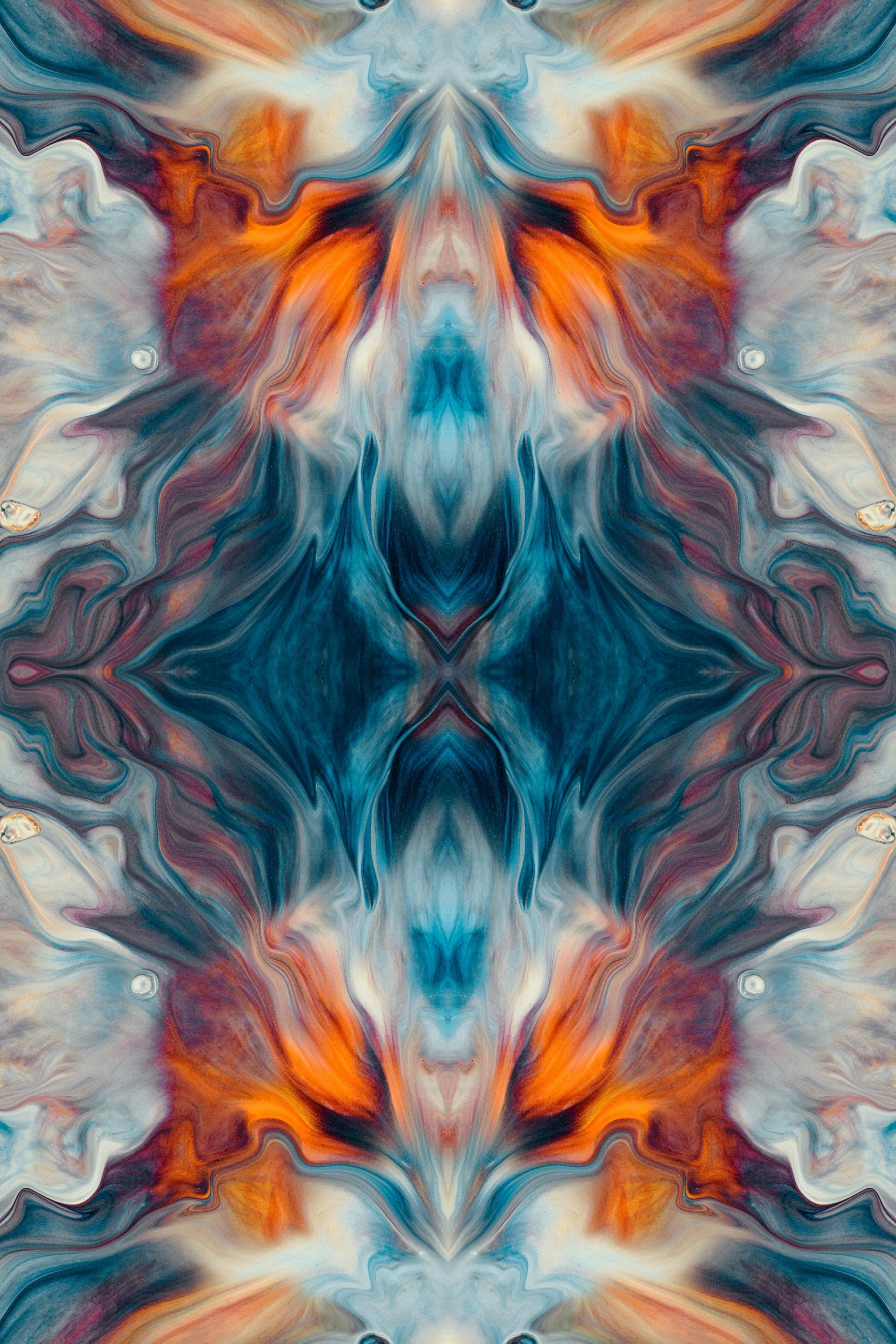 a flower or design with orange, green, red and blue colors