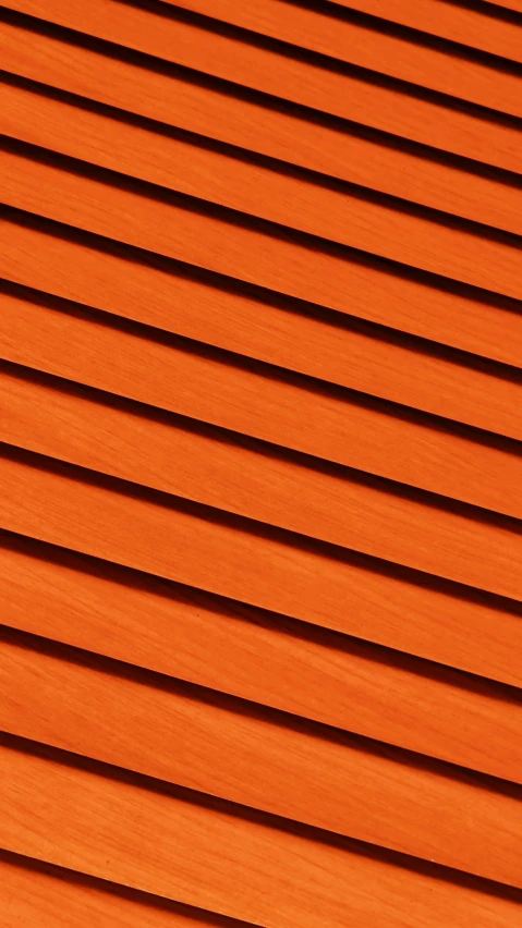 a building with orange colored slats on the exterior