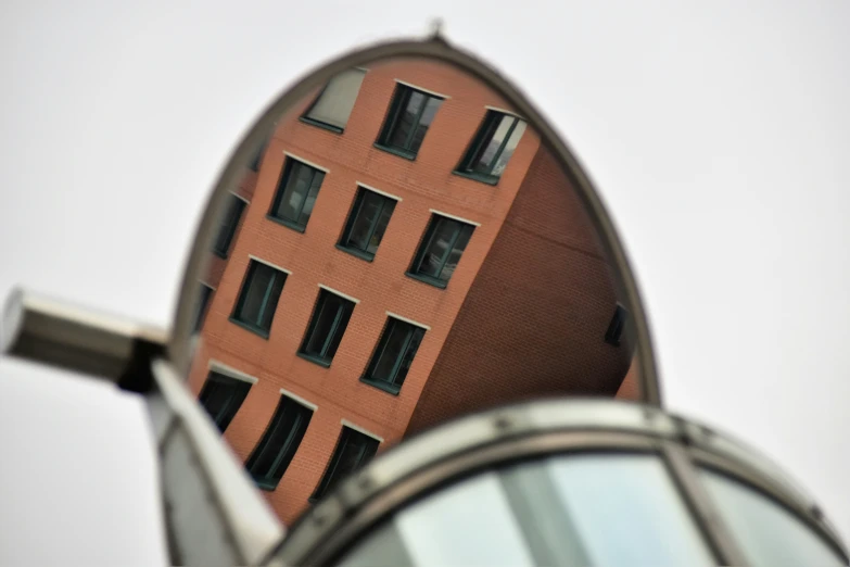 a reflection in a mirror of a building