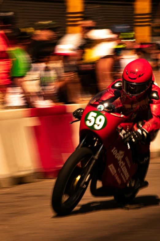 a motorcycle rider on a track going fast