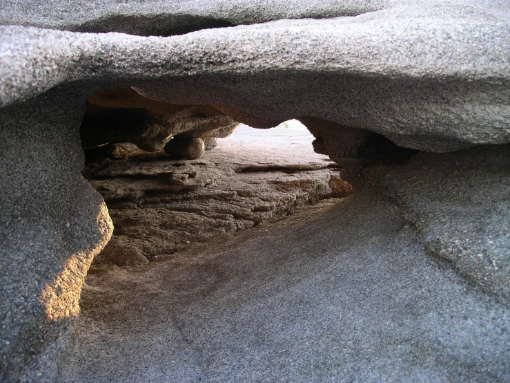 a cave is hidden by the sand