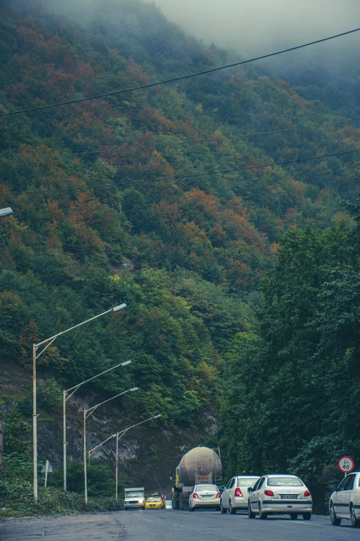 two vehicles parked on the side of a hill