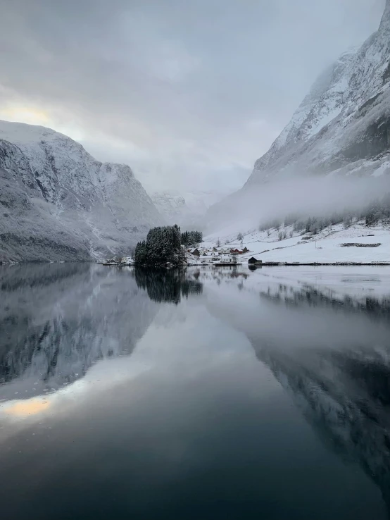 the snowy mountain has a lake on it