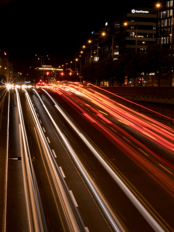 a bunch of cars traveling down the road