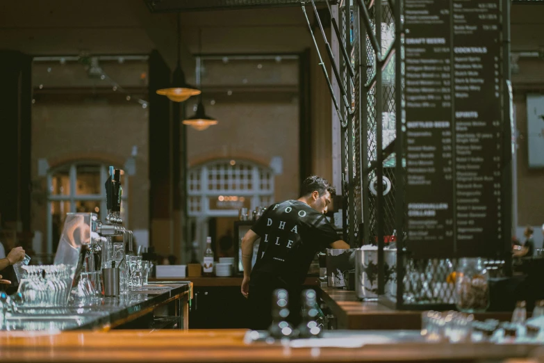 bartenders are behind the bar of a large restaurant