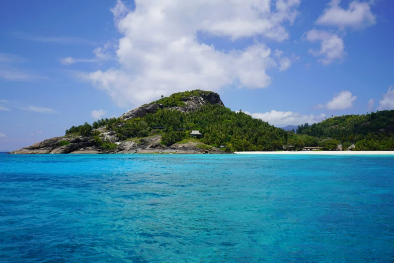 a large island sitting in the middle of a blue ocean