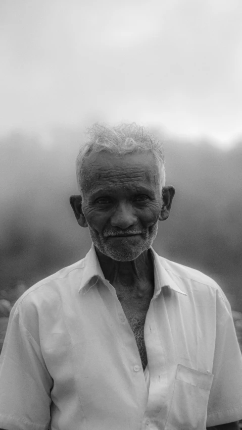 an old man with wrinkles on his face and hand in the sky