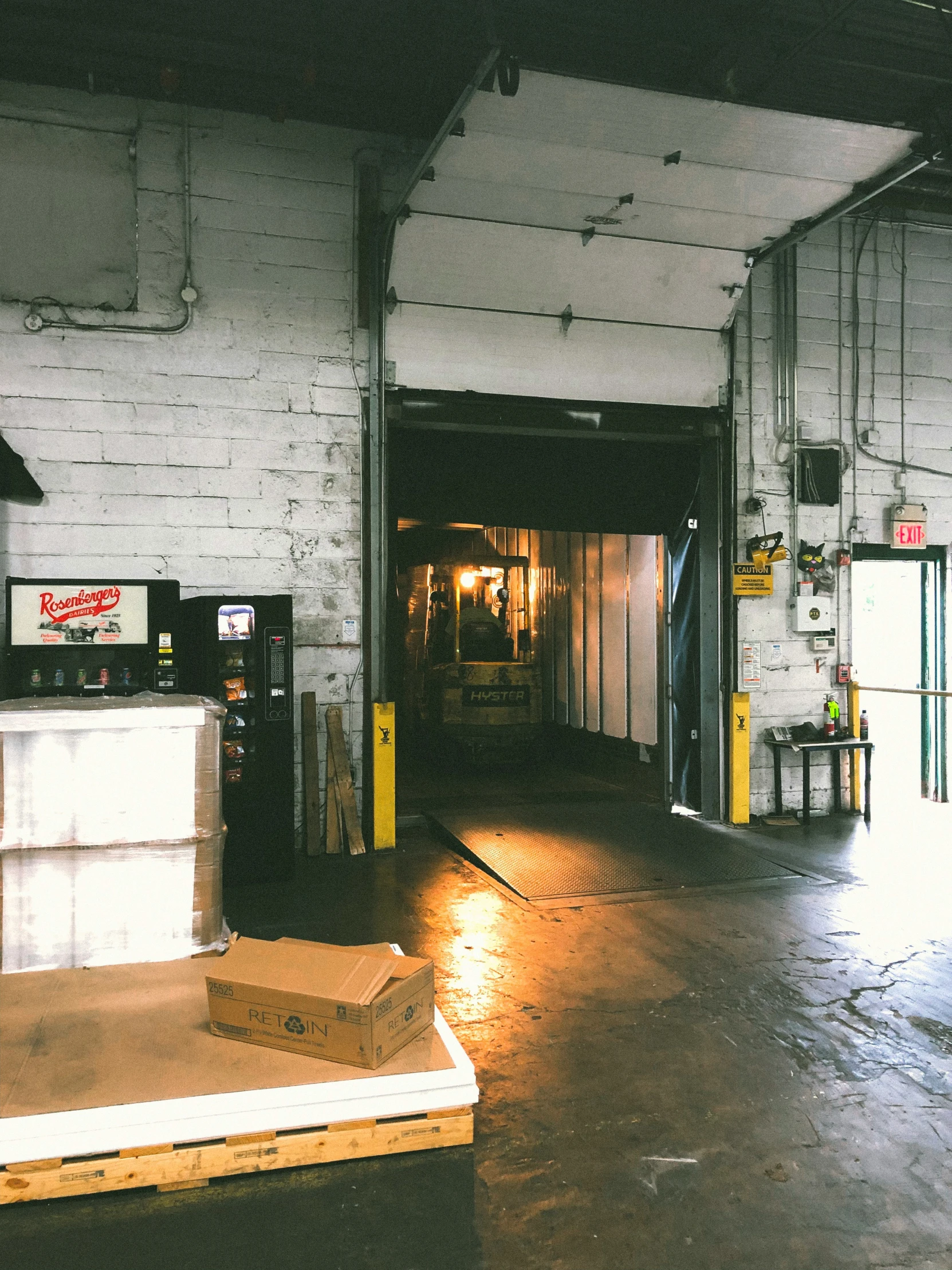 a empty warehouse is lit by a bright light