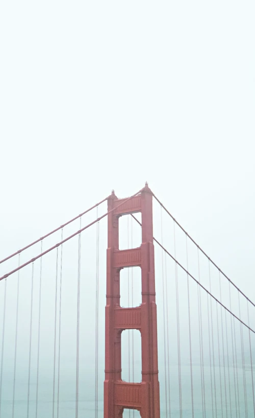 fog hangs over the golden gate bridge in san francisco, california