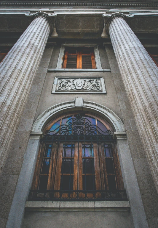 an old building with a double - tiered building