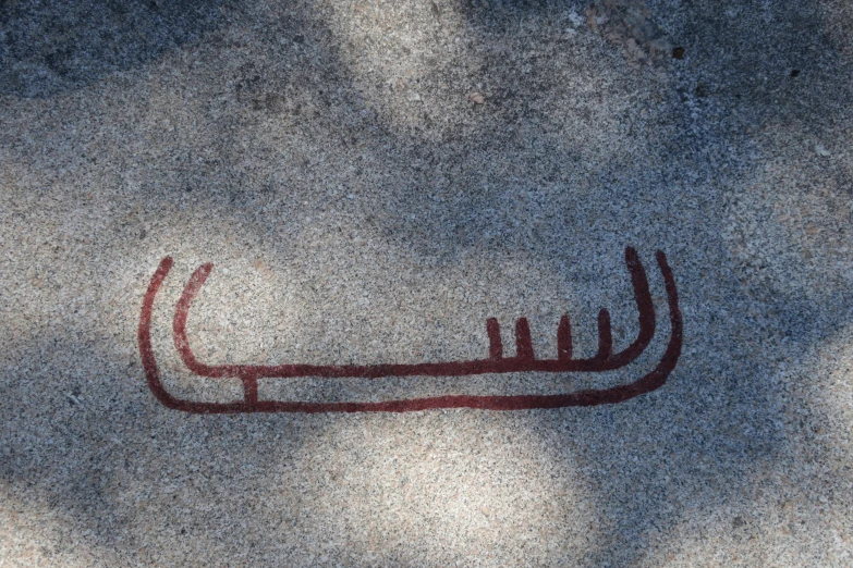 a painting of a long pointed arm on the ground