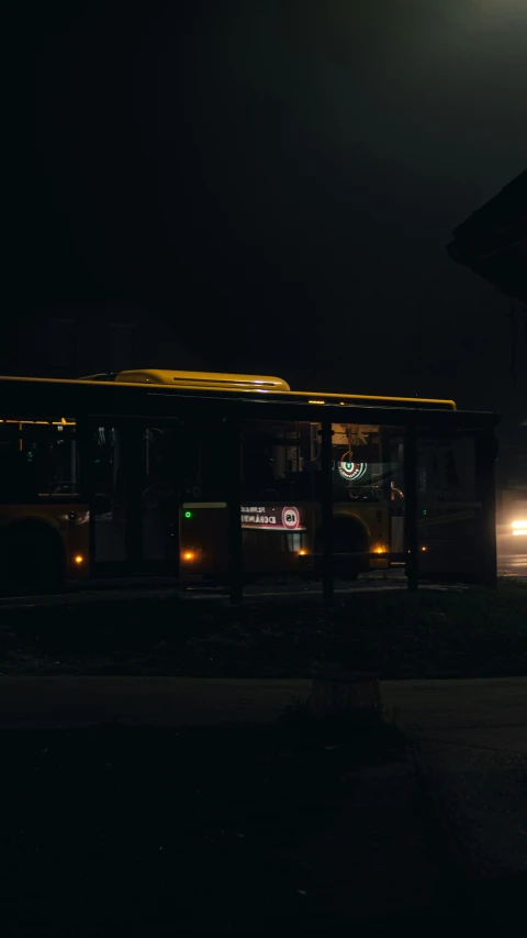 a public transit bus at night on the street