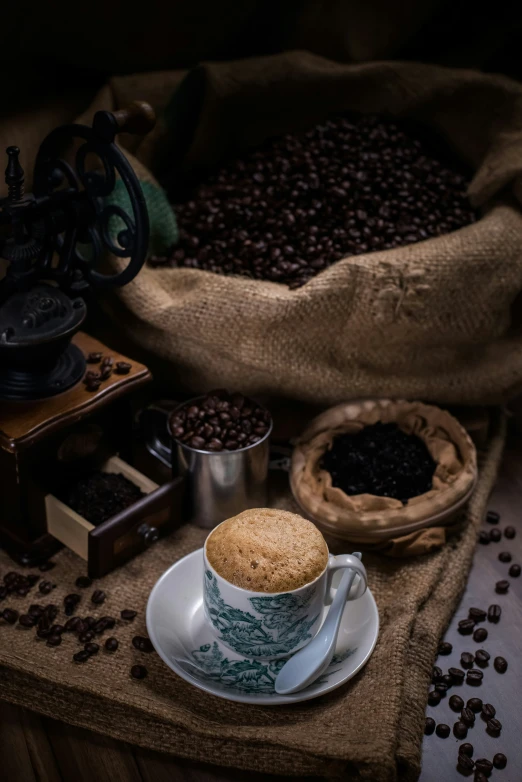 a cup of coffee on top of a white plate