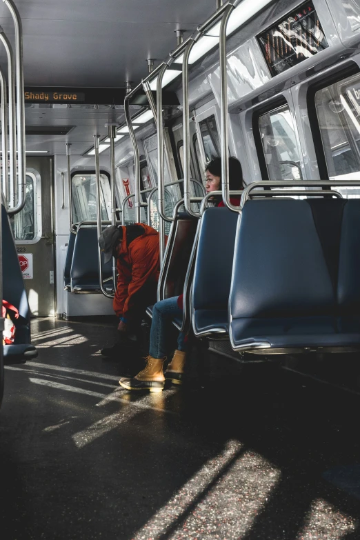 a few people that are sitting in a train