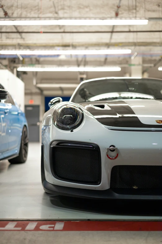 the front end of the sports car has a unique look on it