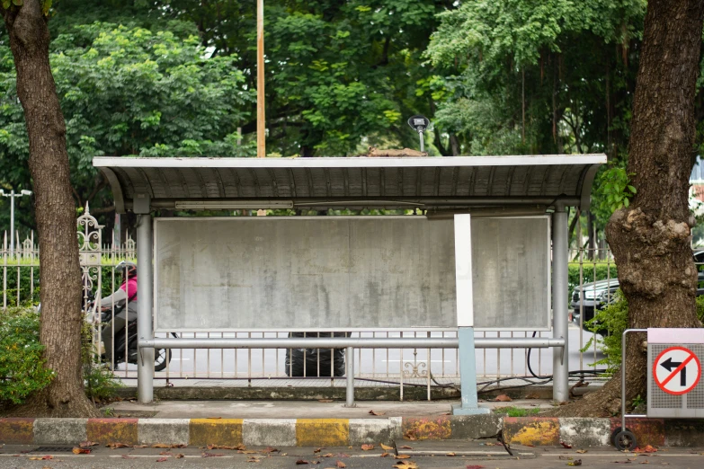 a small shelter for a bicycle rider on the corner