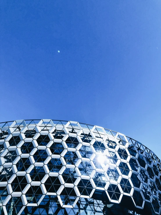 a close up of an external structure made of shiny glass