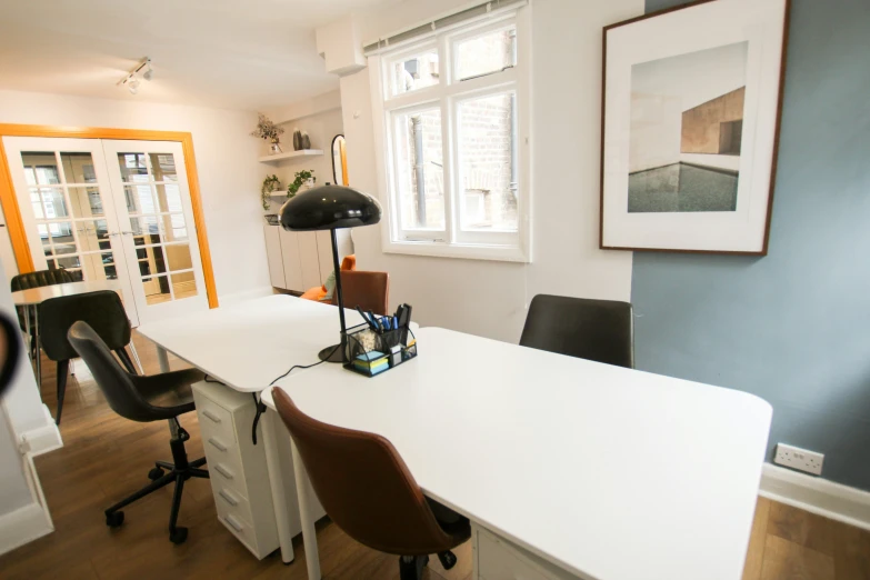 a large desk sitting in the corner of an office